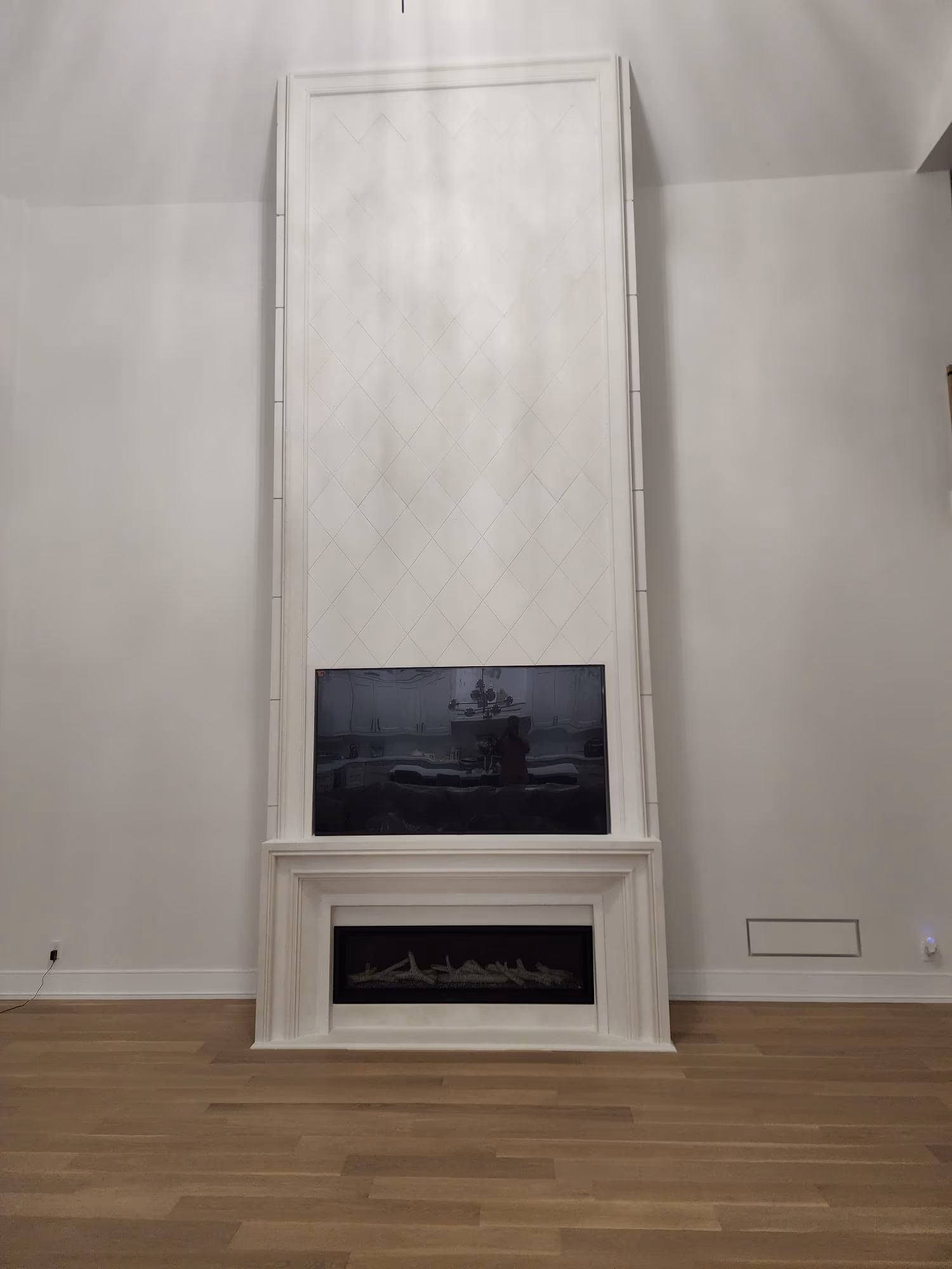Full height fireplace with diamond pattern tile