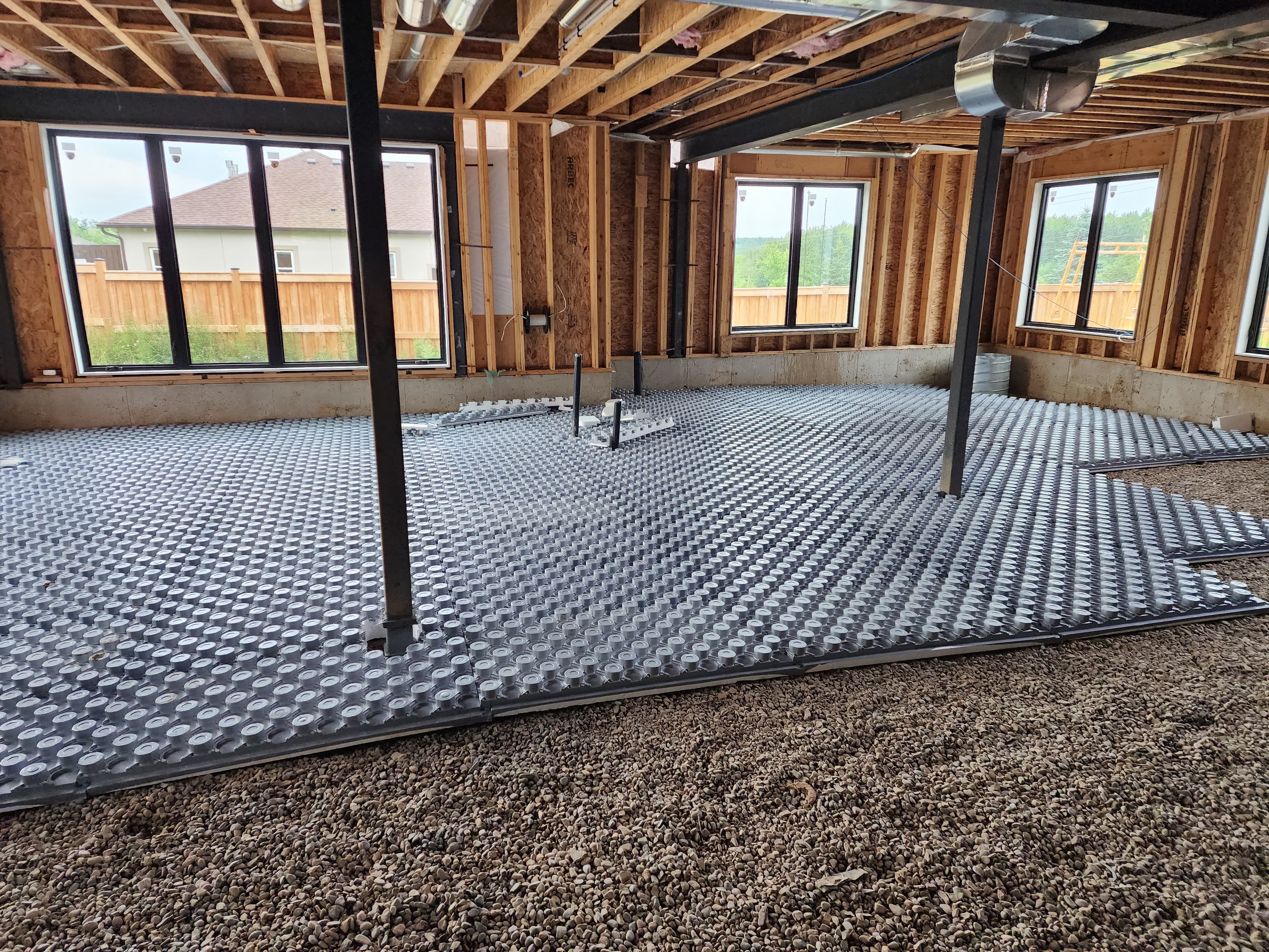 Radiant heated floor installation in new construction