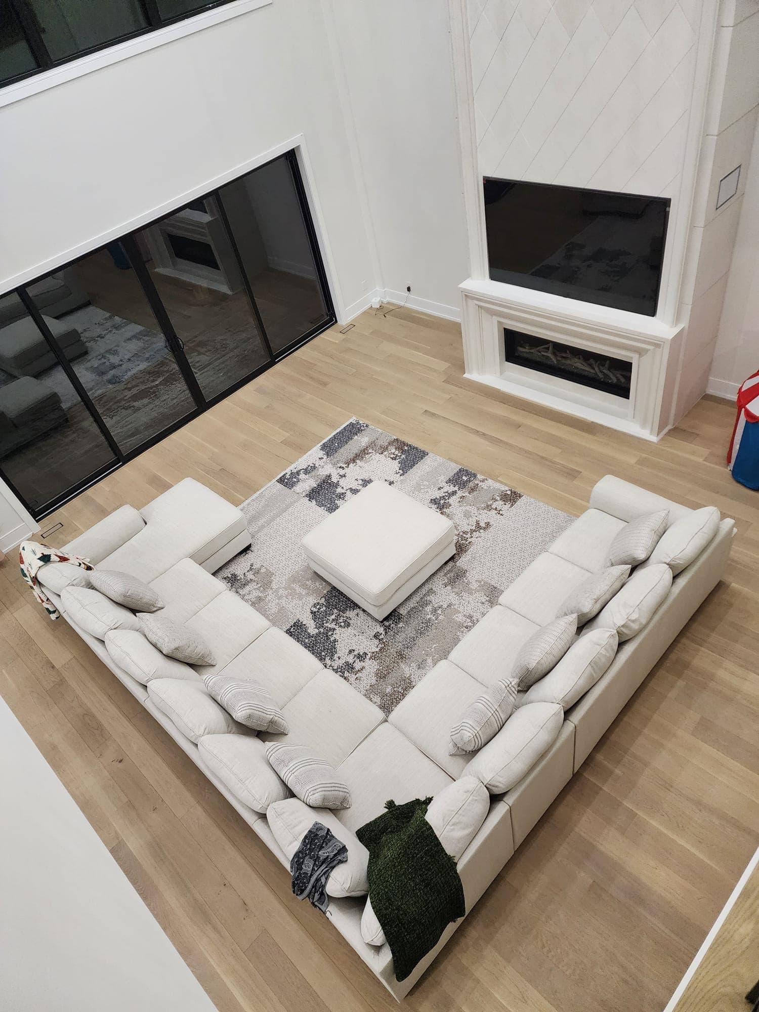 Open concept living room with fireplace overhead view